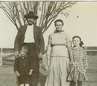  From left to right are James Woodson Turner, Mary Carroll Turner, Mary Bell Turner, and Hugh Turner (boy).